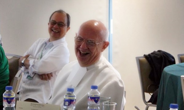 Brother Joseph Scheiter (foreground) smiling at the camera